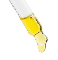 Fototapeta premium Dripping tincture from pipette isolated on white