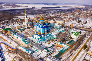 Aerial panoramic view of architectural complex of Nativity of Mother of God Monastery in small...
