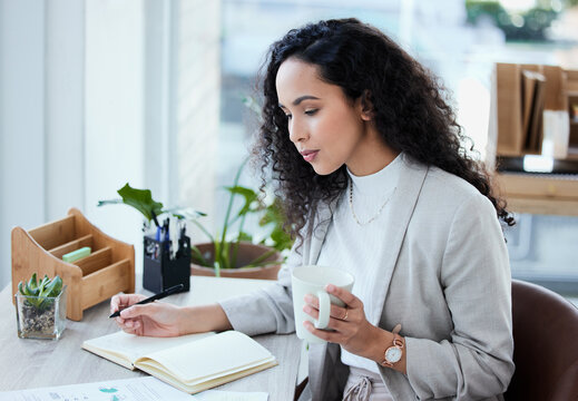 Planning, notes and woman in office with coffee and writing in journal with agenda or schedule. Calm, working and employee relax with espresso and reminder in planner for creative ideas or calendar