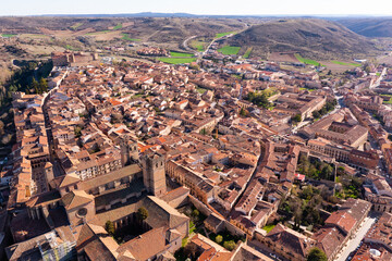 Scenic general drone view of Spanish city of Siguenza located in natural mountain region of Alto Henares on sunny spring day, province of Guadalajara