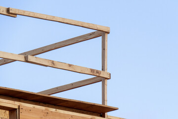 a wooden safety railing at a construction site