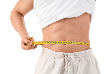 Male bodybuilder measuring his belly on white background, closeup