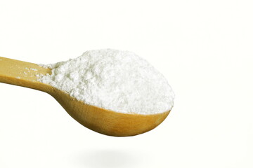 white powder sugar in wooden spoon isolated in white background