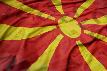 waving colorful national flag of macedonia on a euro money banknotes background. finance concept. - obrazy, fototapety, plakaty