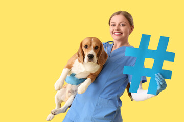 Female veterinarian with hashtag sign and dog on yellow background
