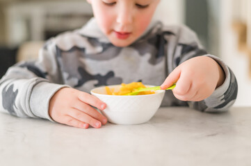 Boy eating Macaroni