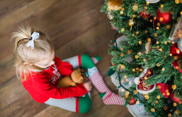 girl decorating christmas tree
