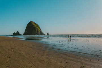 People walking on Cannon Beach.
