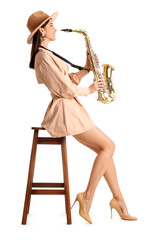 Female artist with saxophone on white background