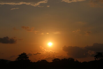 Sunset Sky Clouds in the evening with Red, Orange, Yellow and purple sunlight on Golden hour after sundown.