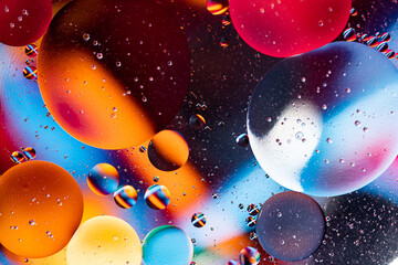 movement of oil bubbles. Fantastic structure of colorful bubbles. Abstract colorful background. Closeup bubbles in water.