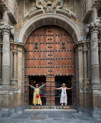 tourists at the door of the san francisco convent in Lima Peru.