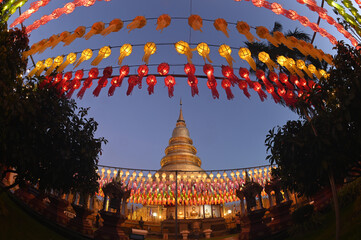 Evening time of Hundred Thousand Lantern Festival at Wat Phra That Hariphunchai. It is an offering of a lantern as a Buddhist offering to Phra That  Hariphunchai. Located in Thailand.