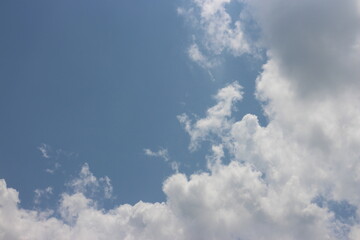 blue sky and white clouds. Freshness of the new day. Bright blue background. Relaxing feeling like being in the sky.