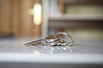 house keys on the ring on table in a room. To forget keys at home concept ,