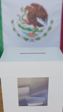 Mexico general elections. Hand of a person putting his vote in a ballot box. Democratic elections day	