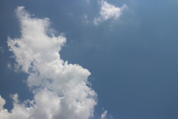 blue sky and white clouds. Freshness of the new day. Bright blue background.
