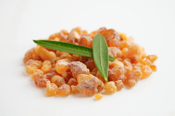 Frankincense or olibanum aromatic resin isolated on white background used in incense and perfumes.