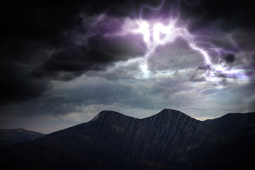 Thunderstorm in mountains. Lightnings and heavy rain