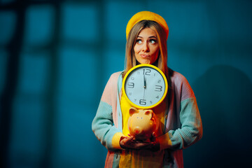 Puzzled Girl Thinking Time Is Priceless Holding Clock. Time is money concept portrait of a retro...