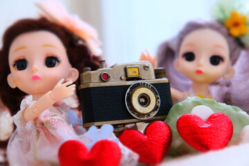 Vintage style, dolls toys with analogue camera and red hearts, Love, wedding, Valentines Day