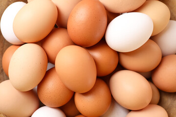 Fresh chicken eggs as background, top view