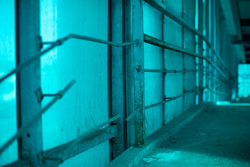 Blue wall. Details of the tunnel over the road. Blue light from a plastic wall.