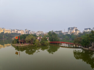 Obraz premium Aerial drone top view of Ngoc Son temple with The Huc bridge, Hoan Kiem lake, Hanoi city