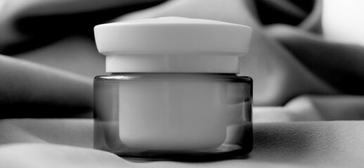 Mockup of cream jar. Packaging for cosmetics. Concept of skin care and advertising.