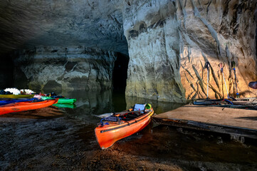 Kayaks lined up at an abandoned underground silica mine that is flooded with water at Crystal City,...