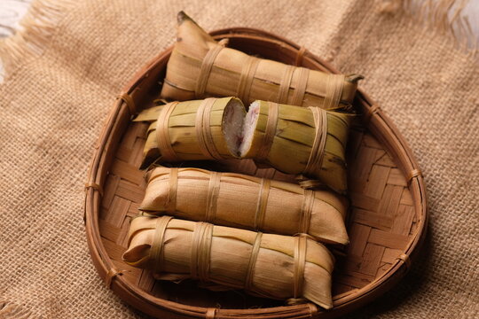 Lepet is a snack made from sticky rice and grated coconut and seasoned with salt, wrapped in young coconut leaves, cylindrical in shape and boiled. Indonesian food.
