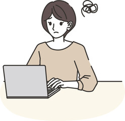 パソコンをしながら困る女性
