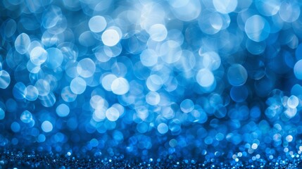 Fototapeta na wymiar Vivid blue bokeh effect creating a sparkling abstract background suitable for a variety of designs and themes.