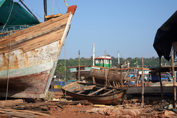 Local boat repair yard near Devgad jetty of Maharashtra, India.