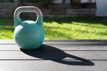 Kettlebell weight in backyard for getting fit and strong