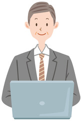 ノートパソコンを使う　スーツ姿の男性　中年　ミドル　会社員　ビジネスマン