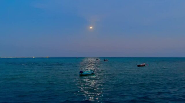 Full moon , Fisherman boat in the sea under moon