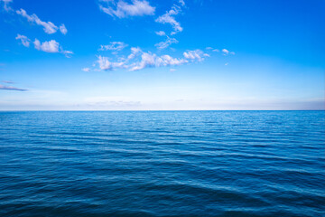 Ocean sea background and the clear sky For summer vacation ideas Nature of summer sea water with sunlight The sea sparkles against the blue sky	