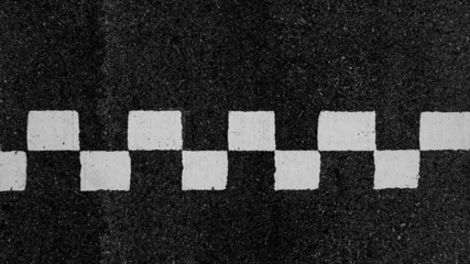  Aerial view abstract asphalt black Start and Finish grid line for race car in circuit texture background, Automobile and automotive background. © Kalyakan