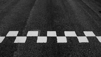 Aerial view abstract asphalt black Start and Finish grid line for race car in circuit texture background, Automobile and automotive background.