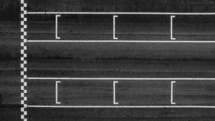 Rolgordijnen zonder boren Aerial view abstract asphalt black Start and Finish grid line for race car in circuit texture background, Automobile and automotive background. © Kalyakan
