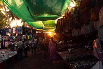 Sunset at the famous Tuesday flee Market in Anjuna, Goa, India.  It is the major tourist attraction...