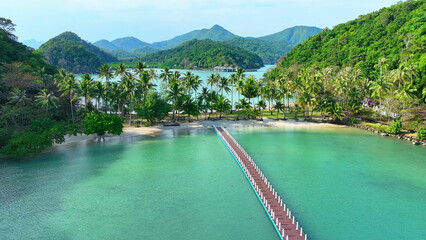 A paradise of turquoise seas, sandy shores, and swaying coconut palms - an aerial view drone...