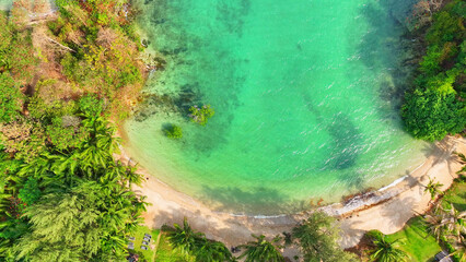 An aerial symphony of paradise: Stunning curved beaches, glass-like seas, and resorts nestled...