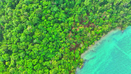Drone captures the stunning blend of vibrant rainforests, crystal waters, and tropical skies on...