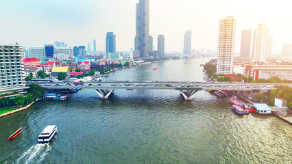 Over the downtown sprawl, the drone surveys skyscrapers lining the Chao Phraya River, a mesmerizing...