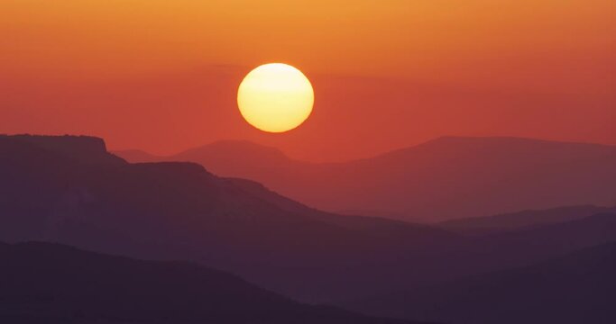 Sun close-up rising at mountain. Beautiful nature video time lapse landscape.