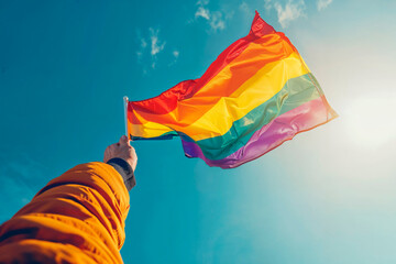 Hand holding rainbow pride flag against sky. Generative AI