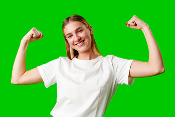 Happy Young Woman Raising Fists against green background