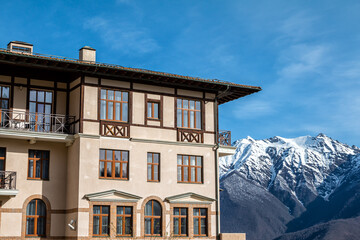Multi storey guest house overlooking picturesque snow capped mountain peaks